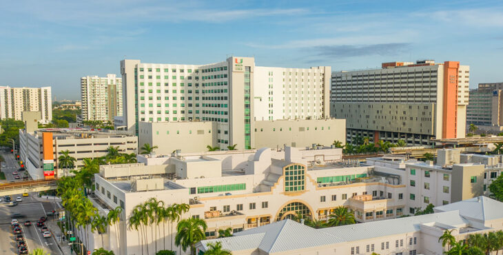 UHealth medical campus from an aerial view, the buildings beneath a blue summer skey